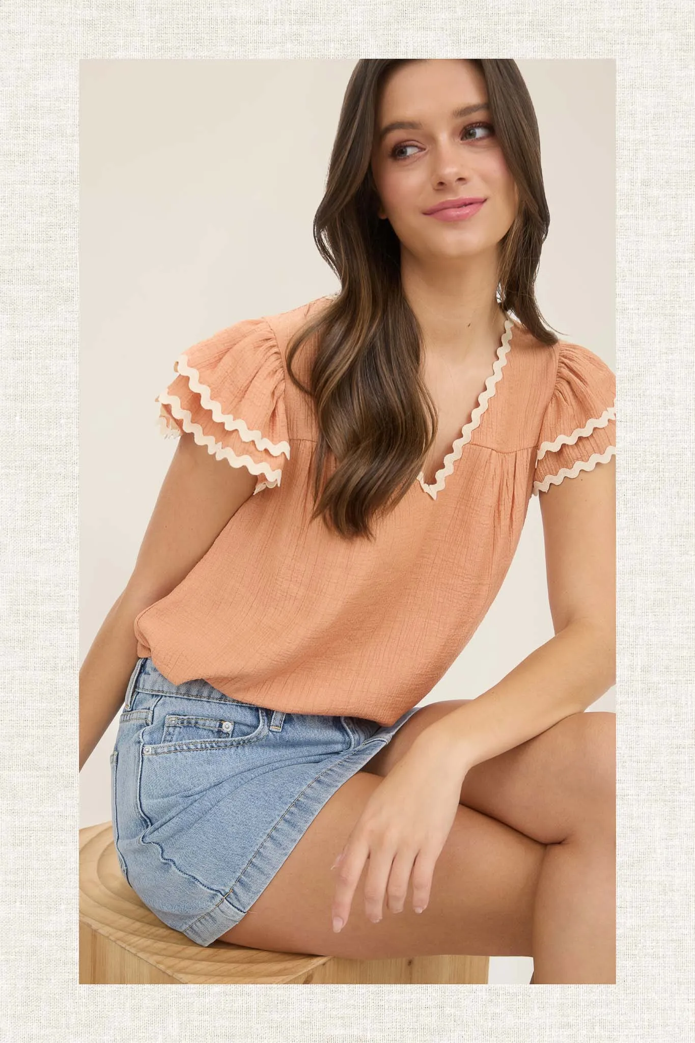 V NECK WAVY TRIM RUFFLE SLEEVE TOP sold by Blu Pepper