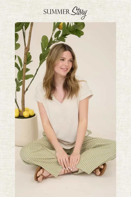 V NECK CUFF SLEEVES BACK TAB PINTUCK DETAIL TOP sold by Blu Pepper