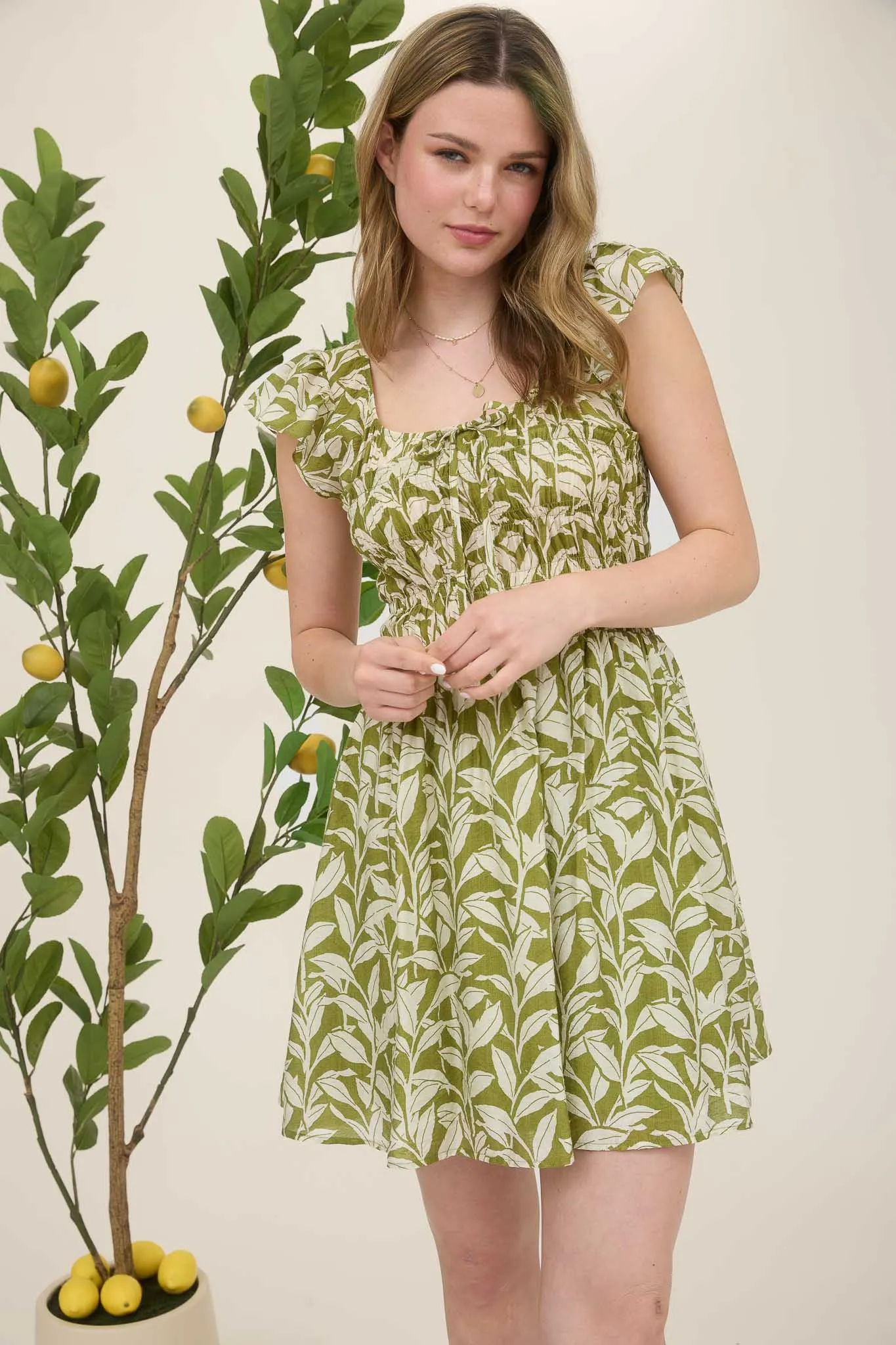 LEAF PRINT FRONT TIE SMOCKED BODICE MINI DRESS sold by Blu Pepper product image thumbnail 4