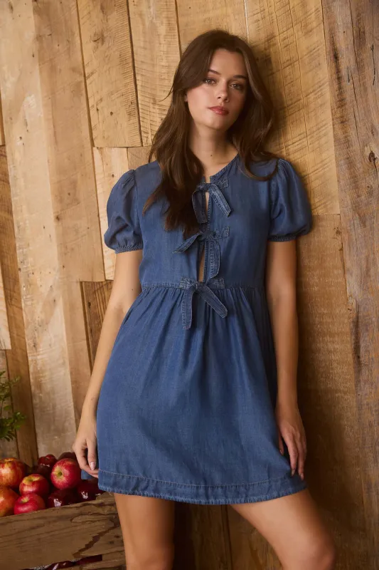 DARK CHAMBRAY FRONT TIE PUFF SLEEVE MINI DRESS sold by Blu Pepper