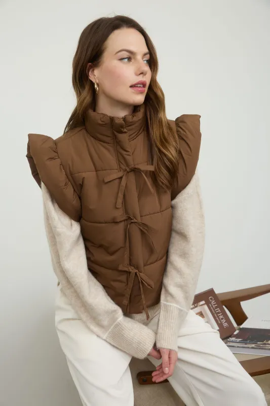 FLUTTER SLEEVE BOW DETAIL ZIP-UP PUFFER VEST (PRE-ORDER) sold by Blu Pepper