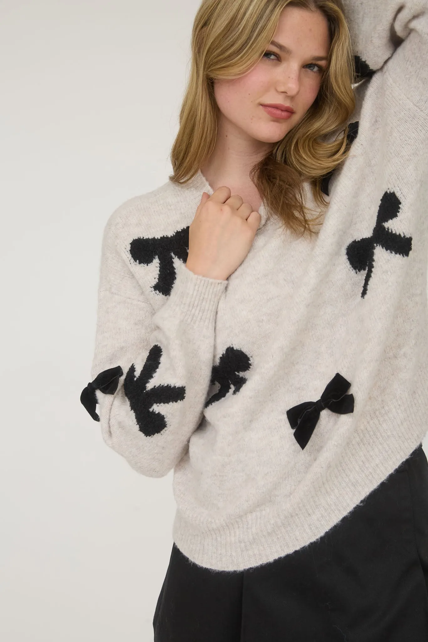 BOW PATTERN LONG SLEEVE KNIT SWEATER sold by Blu Pepper
