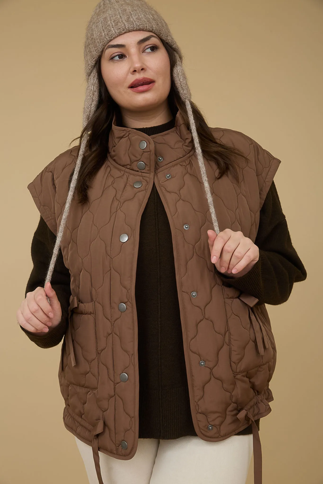 PLUS TIE DETAIL SNAP BUTTON DOWN QUILTED VEST sold by Blu Pepper