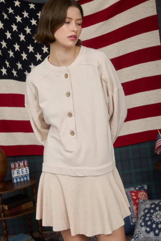 LONG SLEEVE HENLEY RUFFLE HEM MINI SWEATER DRESS sold by Blu Pepper