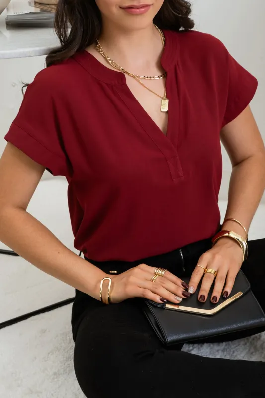 PLUS SOLID SPLIT NECK EXTENDED SHOULDER WOVEN TOP sold by Blu Pepper