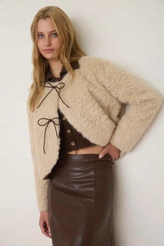 FAUX FUR FRONT BOW DETAIL WRAP COAT sold by Blu Pepper
