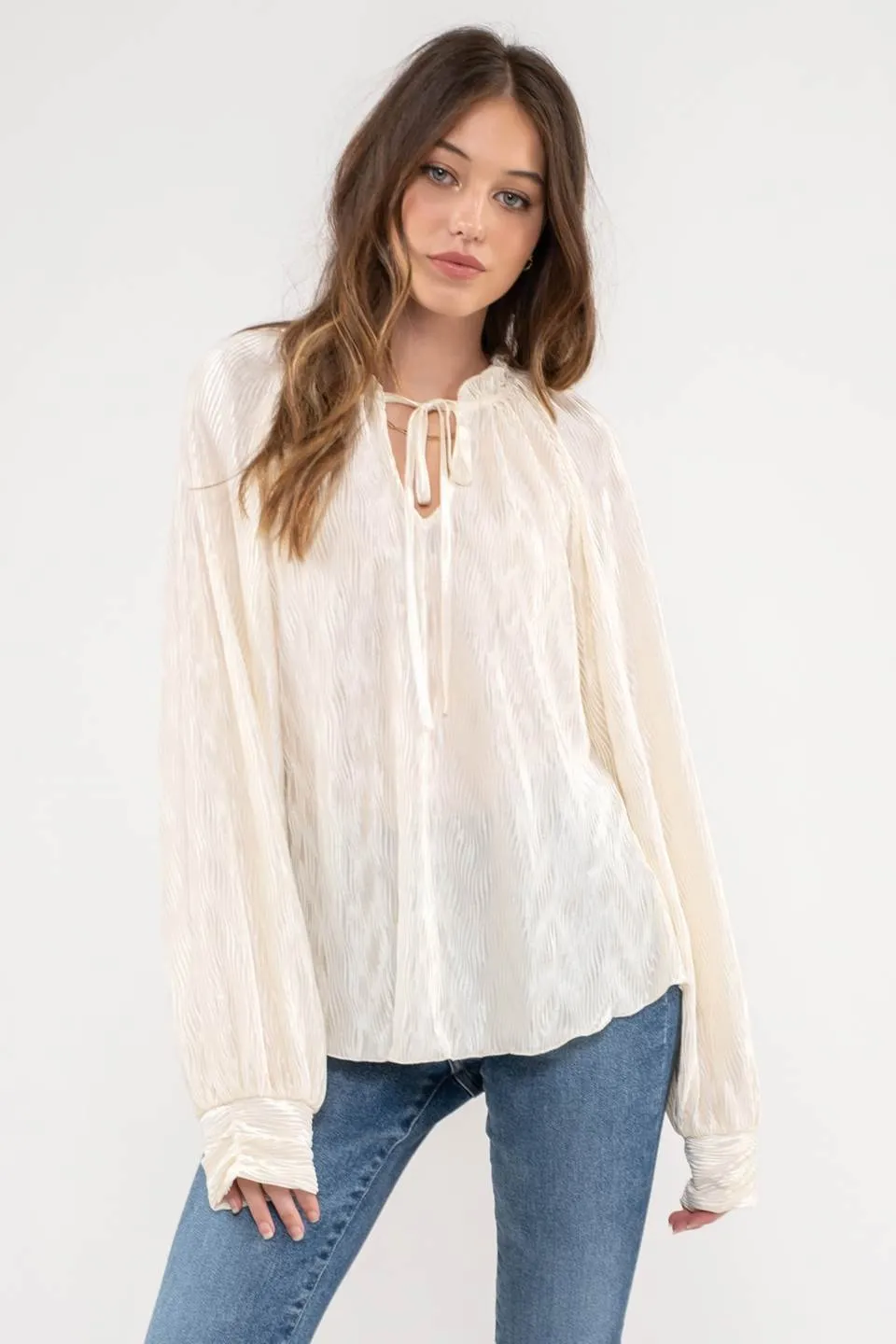 RUFFLE NECK TIE PLISSE LONG SLEEVE TOP sold by Blu Pepper