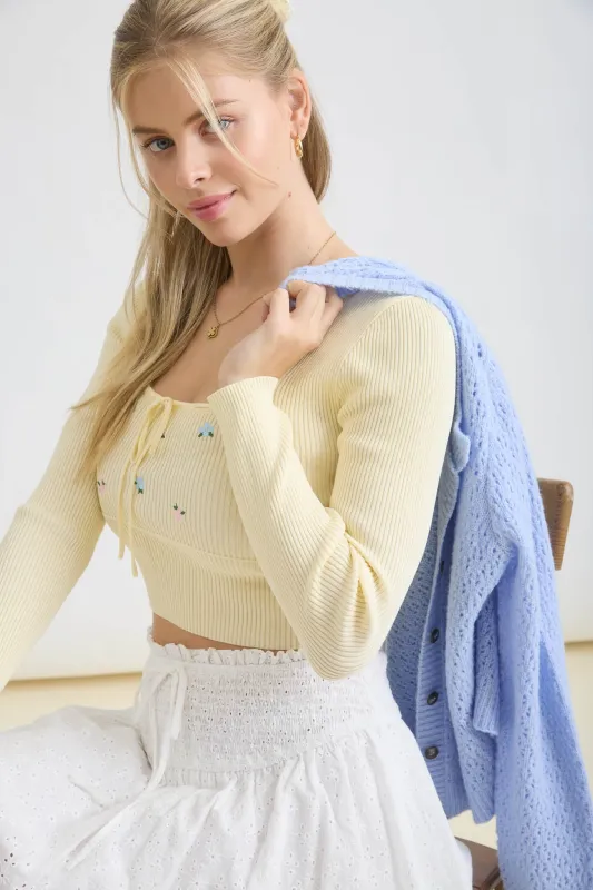 FLORAL EMBROIDERY FRONT TIE CROPPED KNIT SWEATER sold by Blu Pepper
