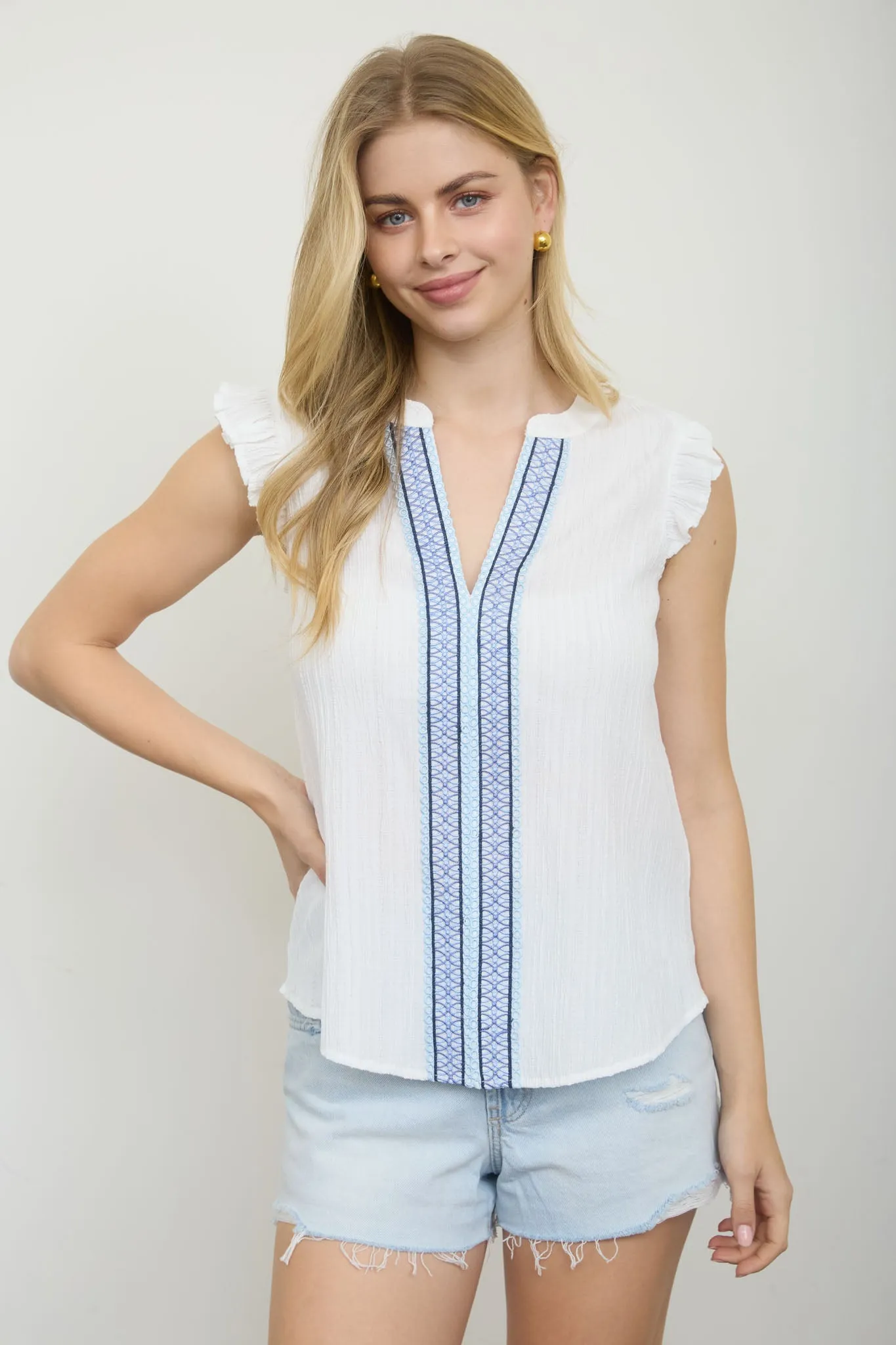 EMBROIDERED FRONT SPLIT NECK PLISSE TOP sold by Blu Pepper