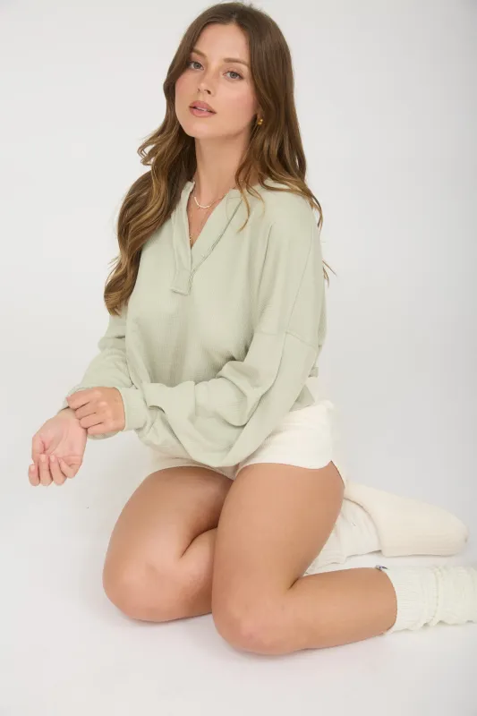 SPLIT NECK LONG SLEEVE CROPPED KNIT TOP made by J.O.A.