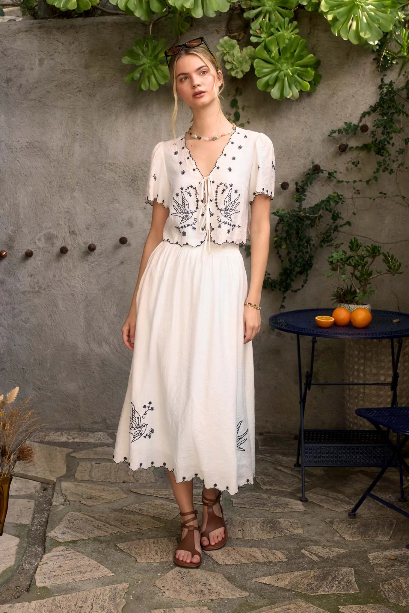 BIRD EMBROIDERY DETAIL MIDI SKIRT sold by Blu Pepper