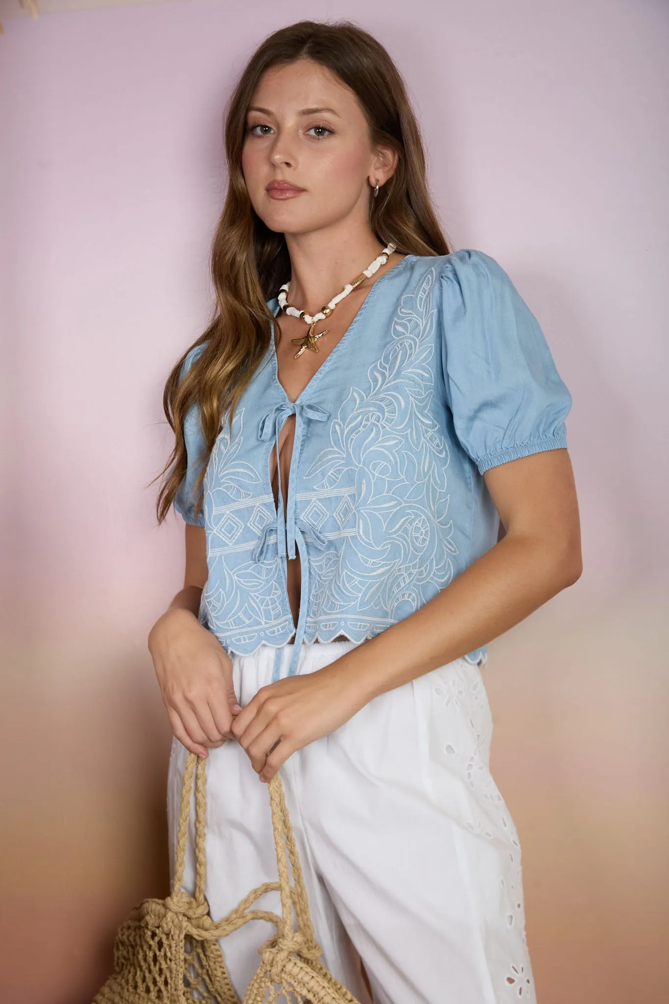 EMBROIDERED FRONT TIE SCALLOPED CHAMBRAY TOP sold by Blu Pepper
