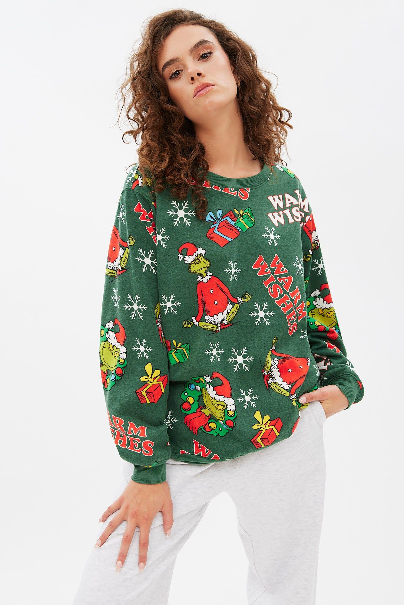The Grinch Warm Wishes Graphic Oversized Pullover Sweatshirt sold by Bluenotes