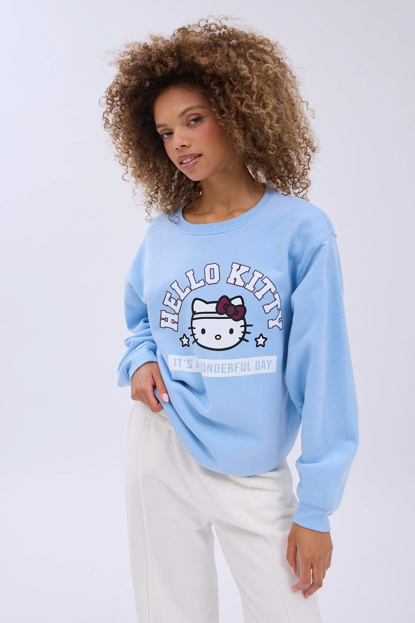 Hello Kitty It's A Wonderful Day Graphic Crew Neck Relaxed Sweatshirt sold by Bluenotes