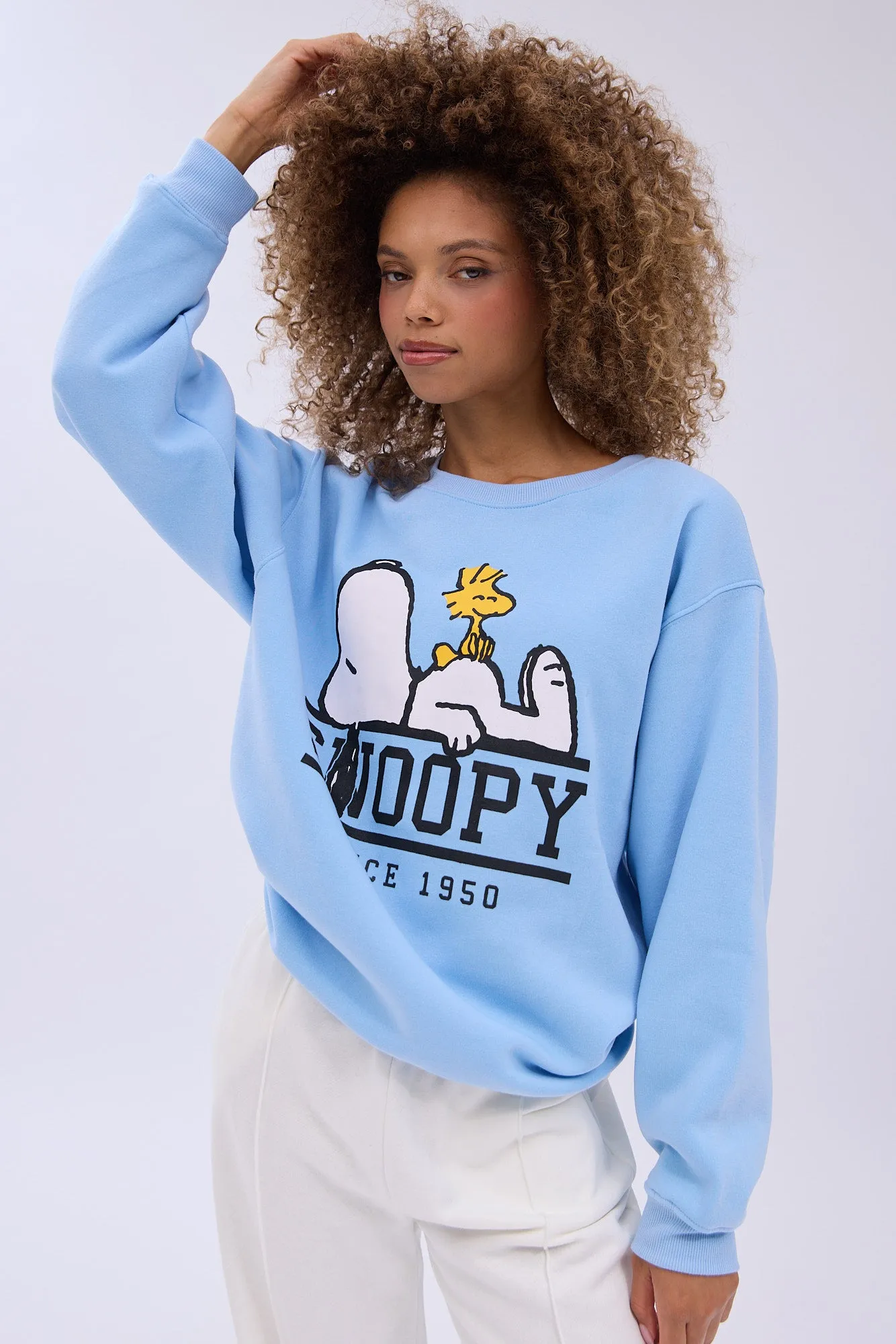Peanuts Snoopy Since 1950 Graphic Crew Neck Relaxed Sweatshirt sold by Bluenotes