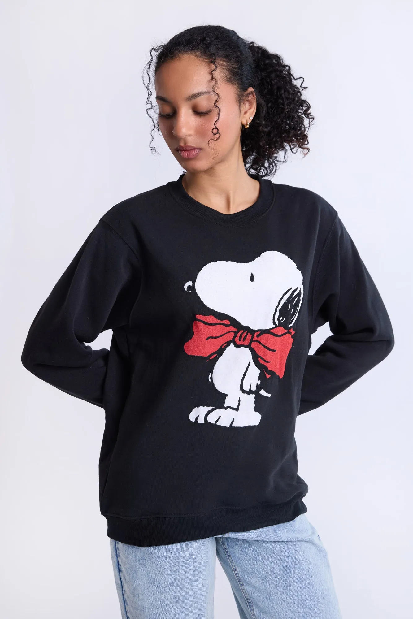 Peanuts Snoopy Bow Graphic Crew Neck Sweatshirt sold by Bluenotes