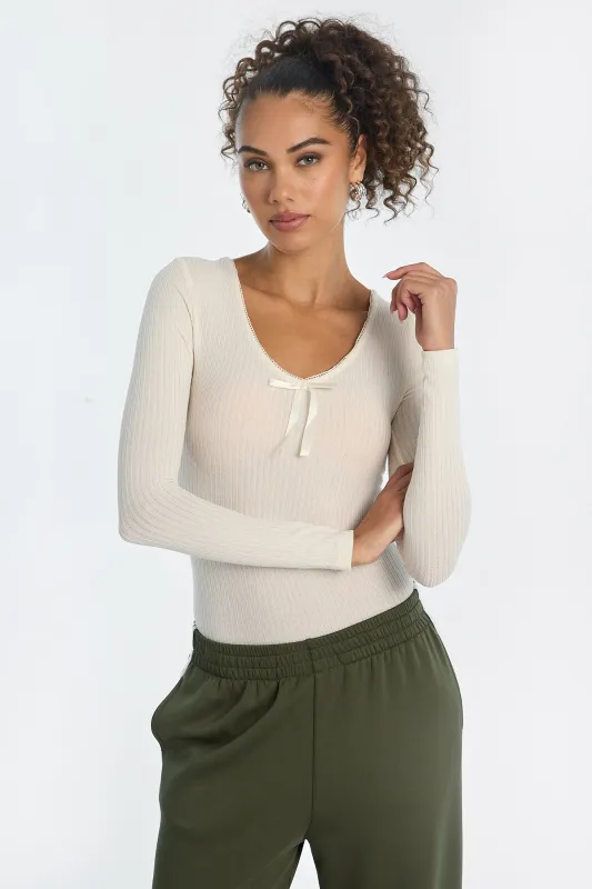 Ribbed Knit Long Sleeve V-Neck Bodysuit sold by Bluenotes