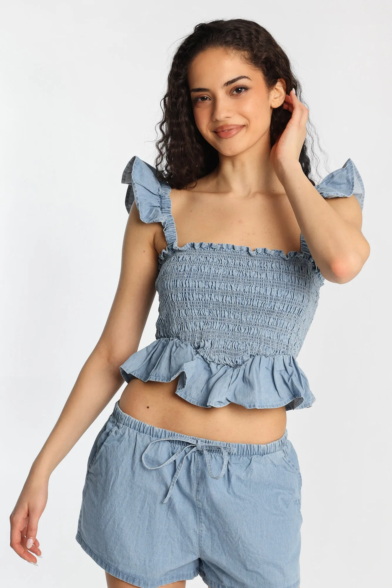 Chambray Flutter Sleeve Smocked Top sold by Bluenotes