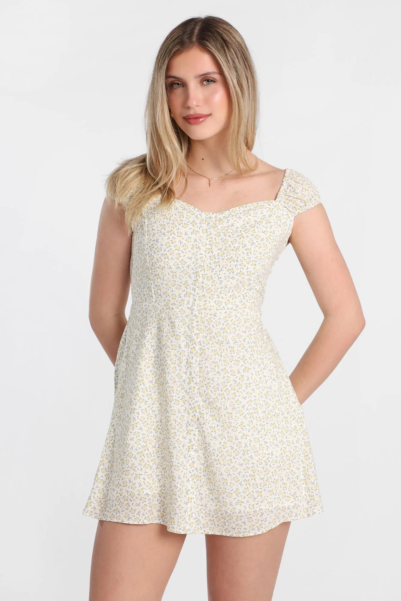 Button-Front Mini Dress sold by Bluenotes