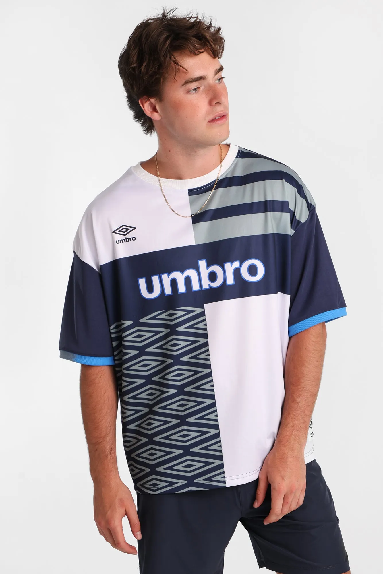 Umbro Large Logo Striped Tee sold by Bluenotes