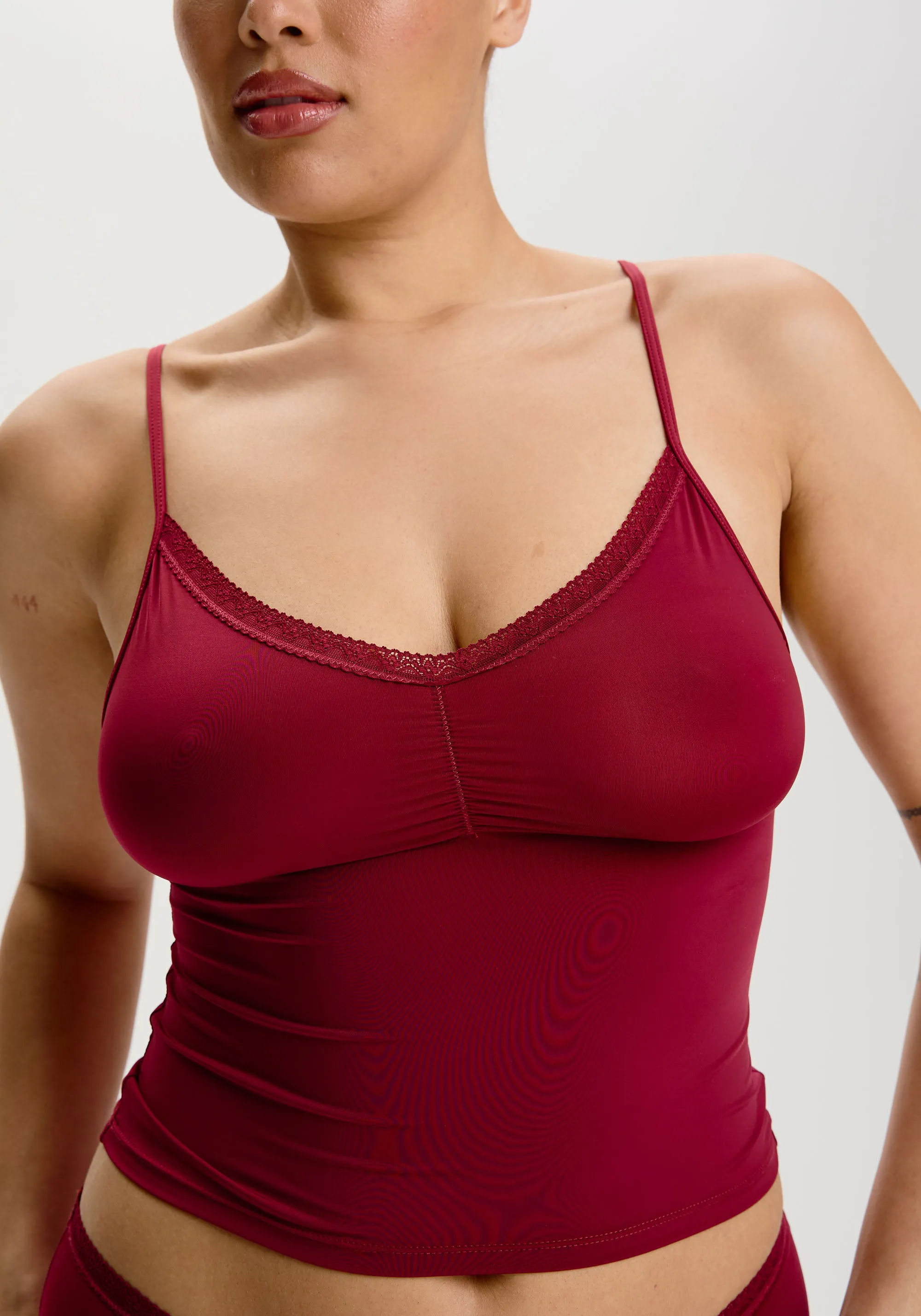 the micro lace trim cami sold by Blush