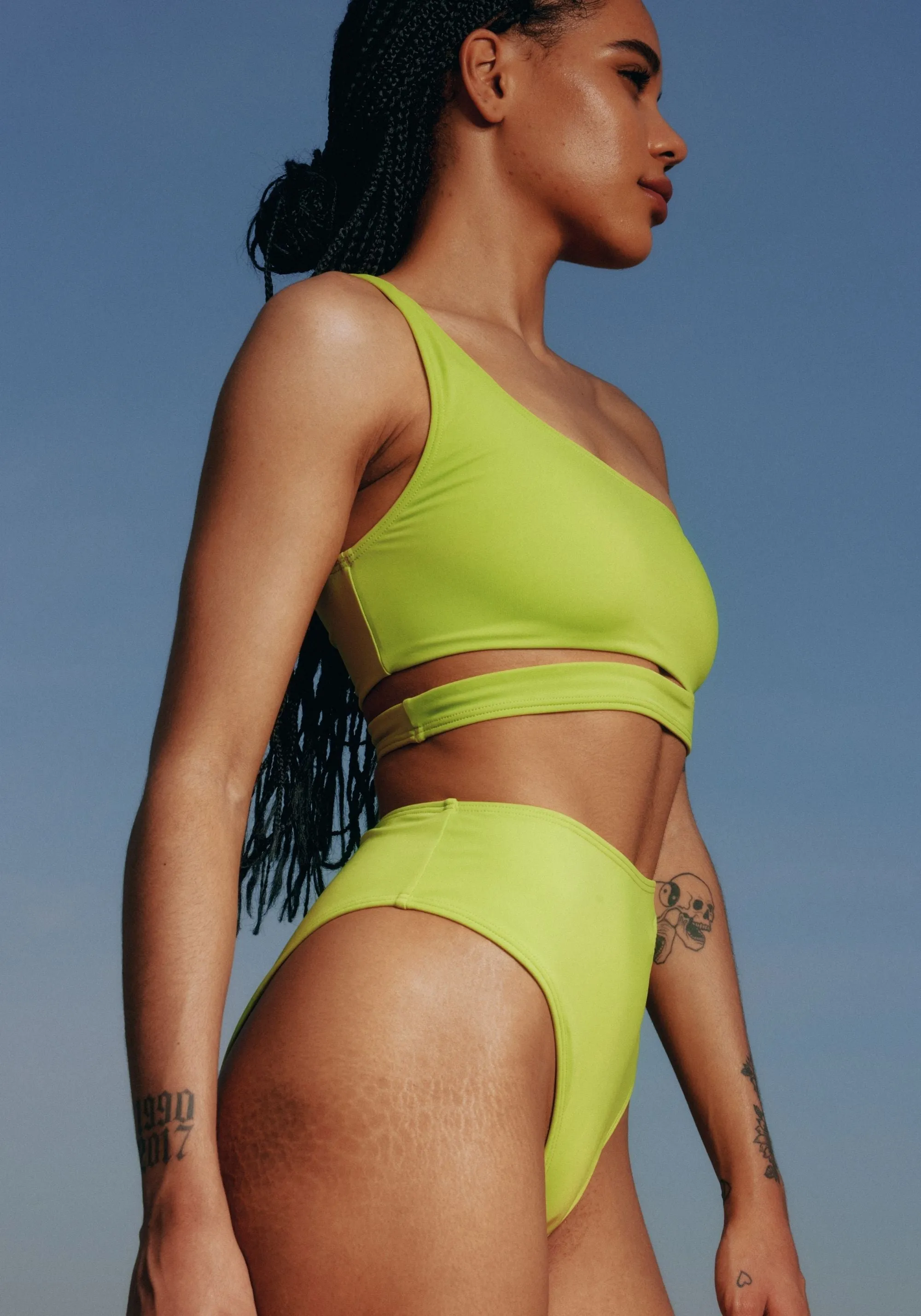 jade asymmetric bikini top sold by Blush