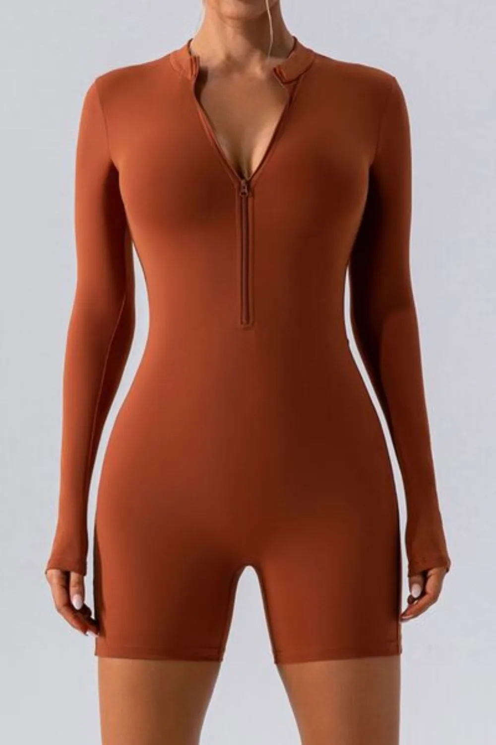 Half Zip Long Sleeve Active Romper sold by Body Central
