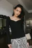 Nyla Ribbed Sweater in Black sold by bohme