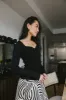 Nyla Ribbed Sweater in Black sold by bohme