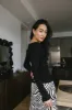 Nyla Ribbed Sweater in Black sold by bohme