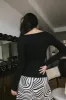 Nyla Ribbed Sweater in Black sold by bohme