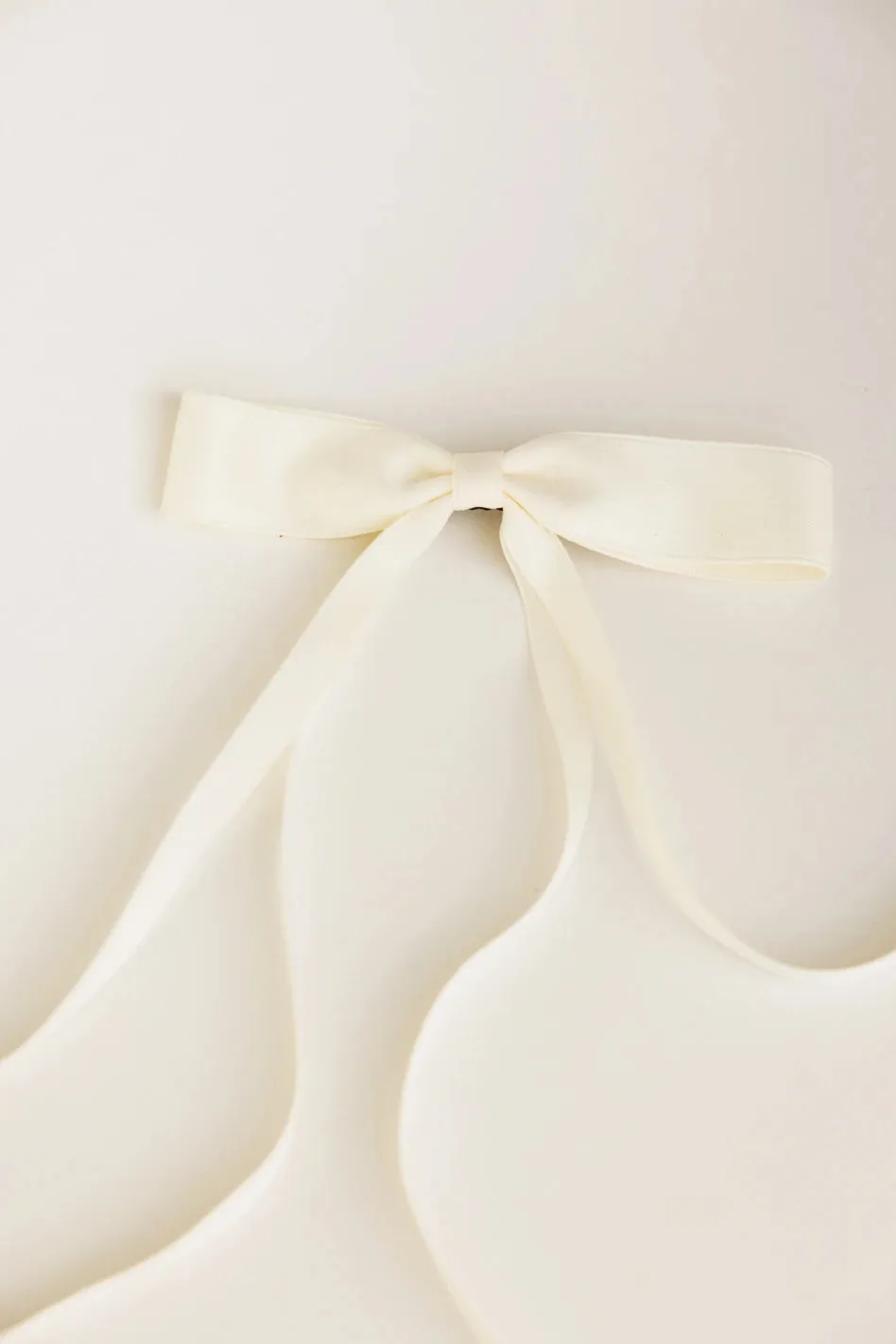 Bow Hair Clip in Cream sold by bohme