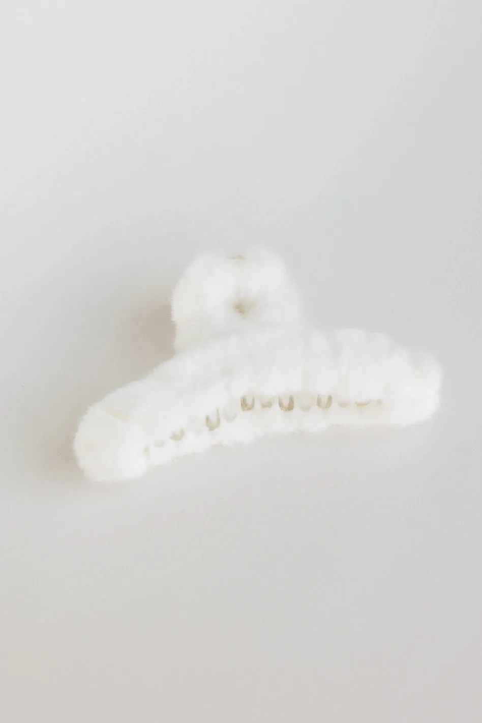 Fuzzy Claw Clip in Cream sold by bohme