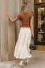 Carey Maxi Dress in Brown sold by bohme