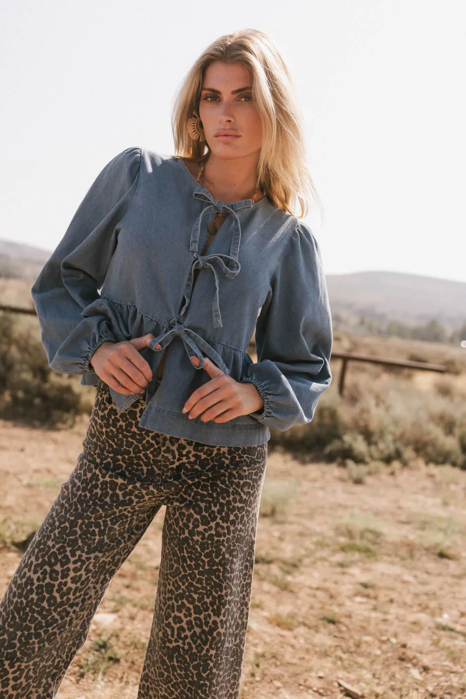 Maggie Peplum Tie Blouse in Medium Wash sold by bohme