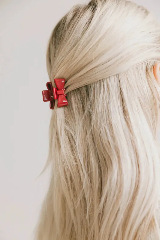 Mini Bow Claw Clip in Red sold by bohme