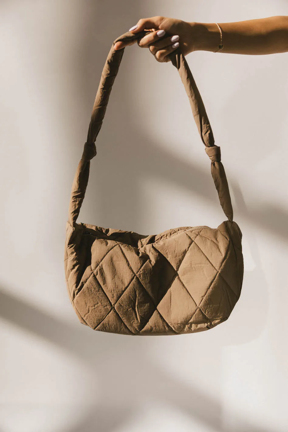 Whimsy Quilted Bag in Taupe sold by bohme