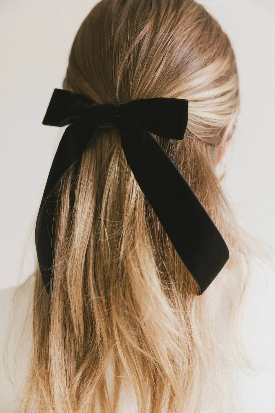 Long Tail Velvet Bow in Black sold by bohme
