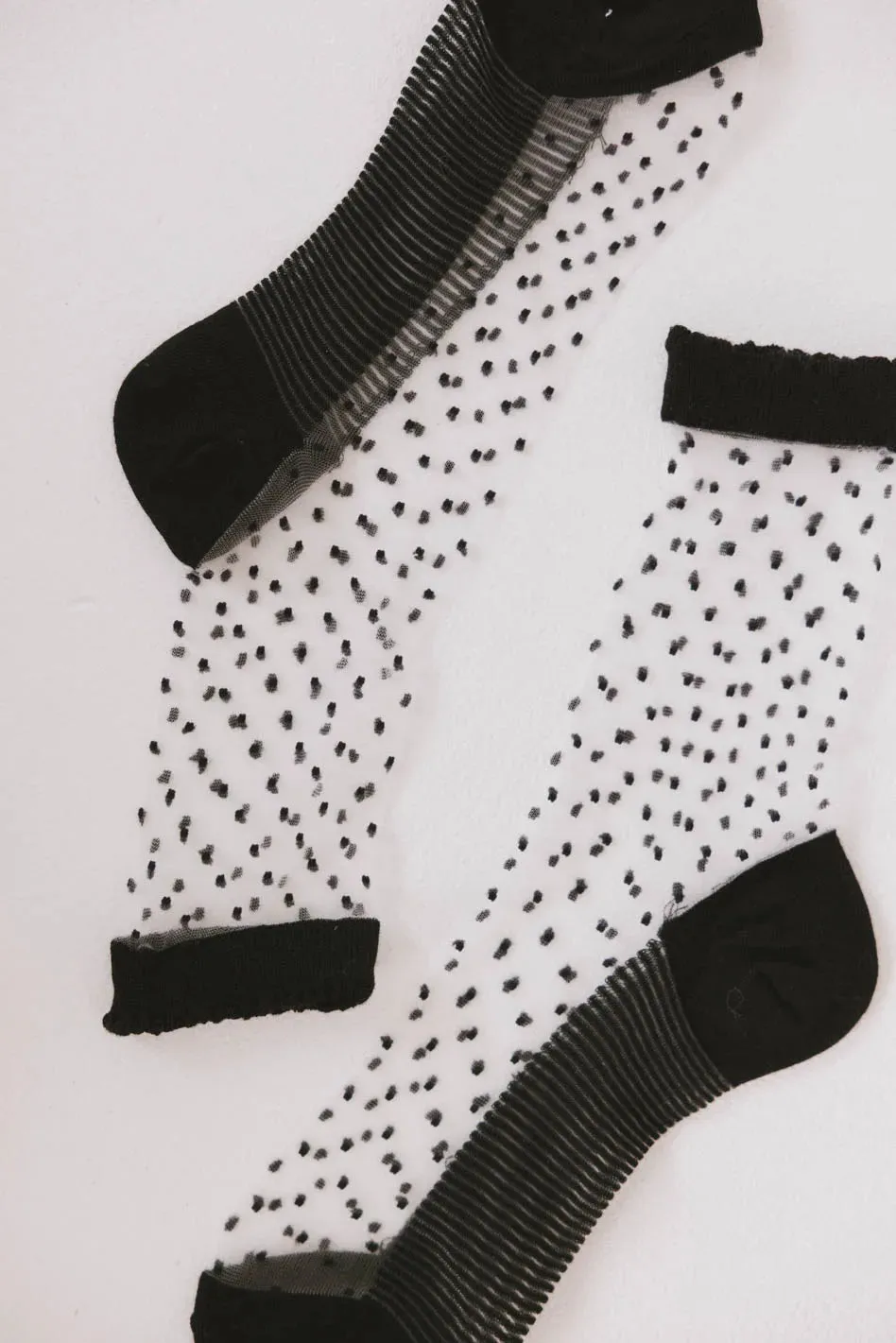 Sheer Speckled Socks in Black sold by bohme