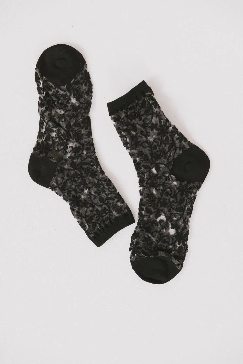 Semi Sheer Floral Socks in Black sold by bohme