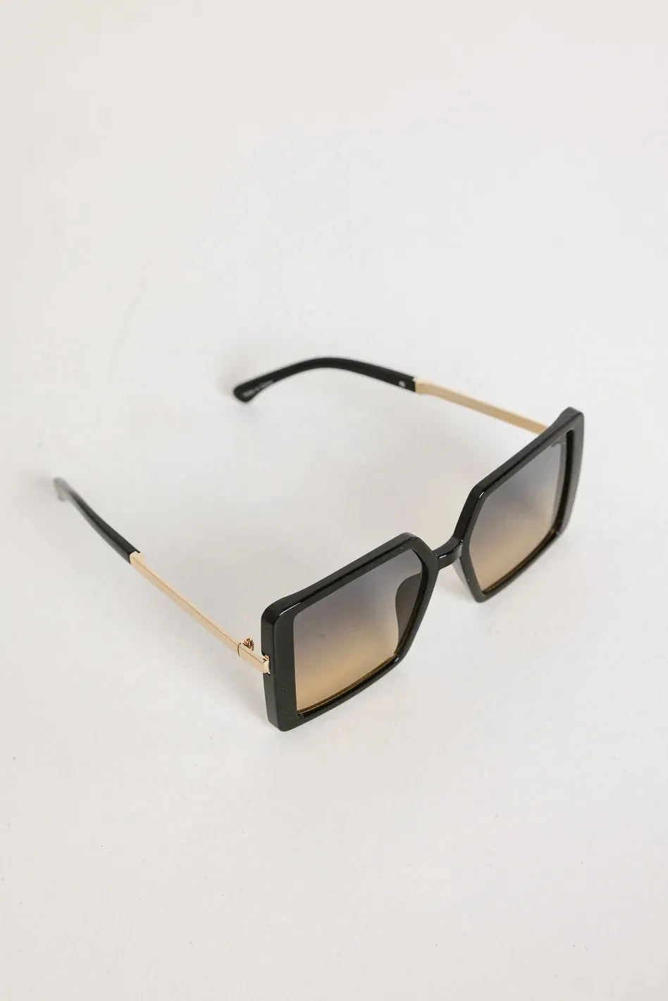 Elara Oversized Sunglasses in Black sold by bohme