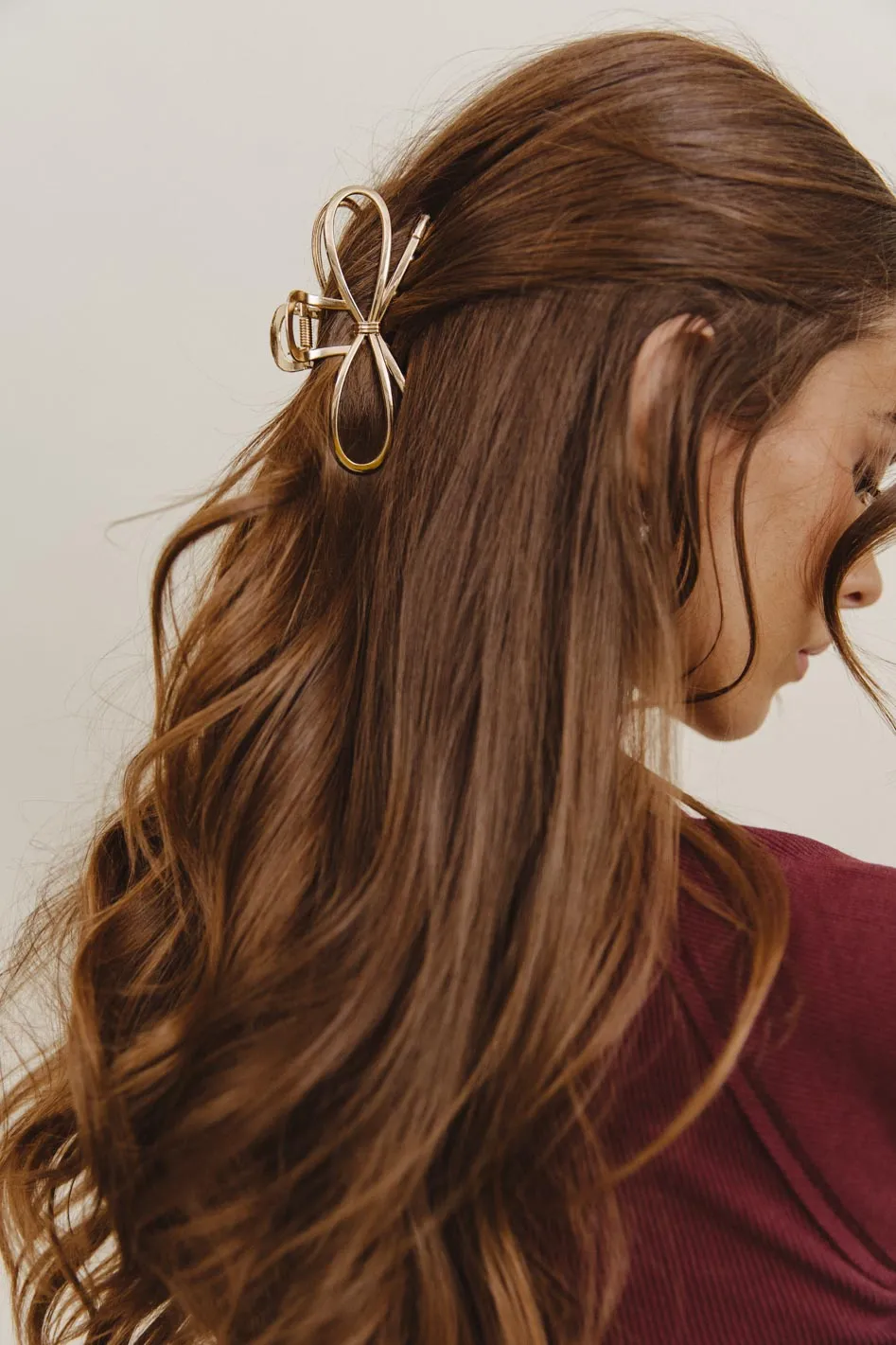 Metal Bow Claw Clip in Gold sold by bohme