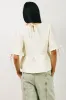 Alessia Peplum Top in Cream sold by bohme