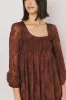 Miles Smocked Mini Dress in Red-Brown sold by bohme