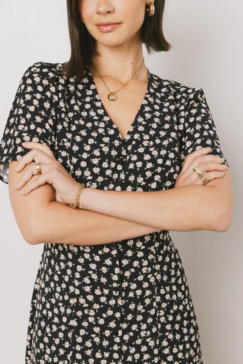 Malik Floral Midi Dress in Black sold by bohme