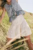 Skyler Tiered Mini Skirt in Cream sold by bohme