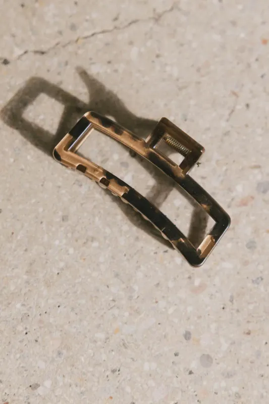 Abstract Cutout Claw Clip in Brown sold by bohme