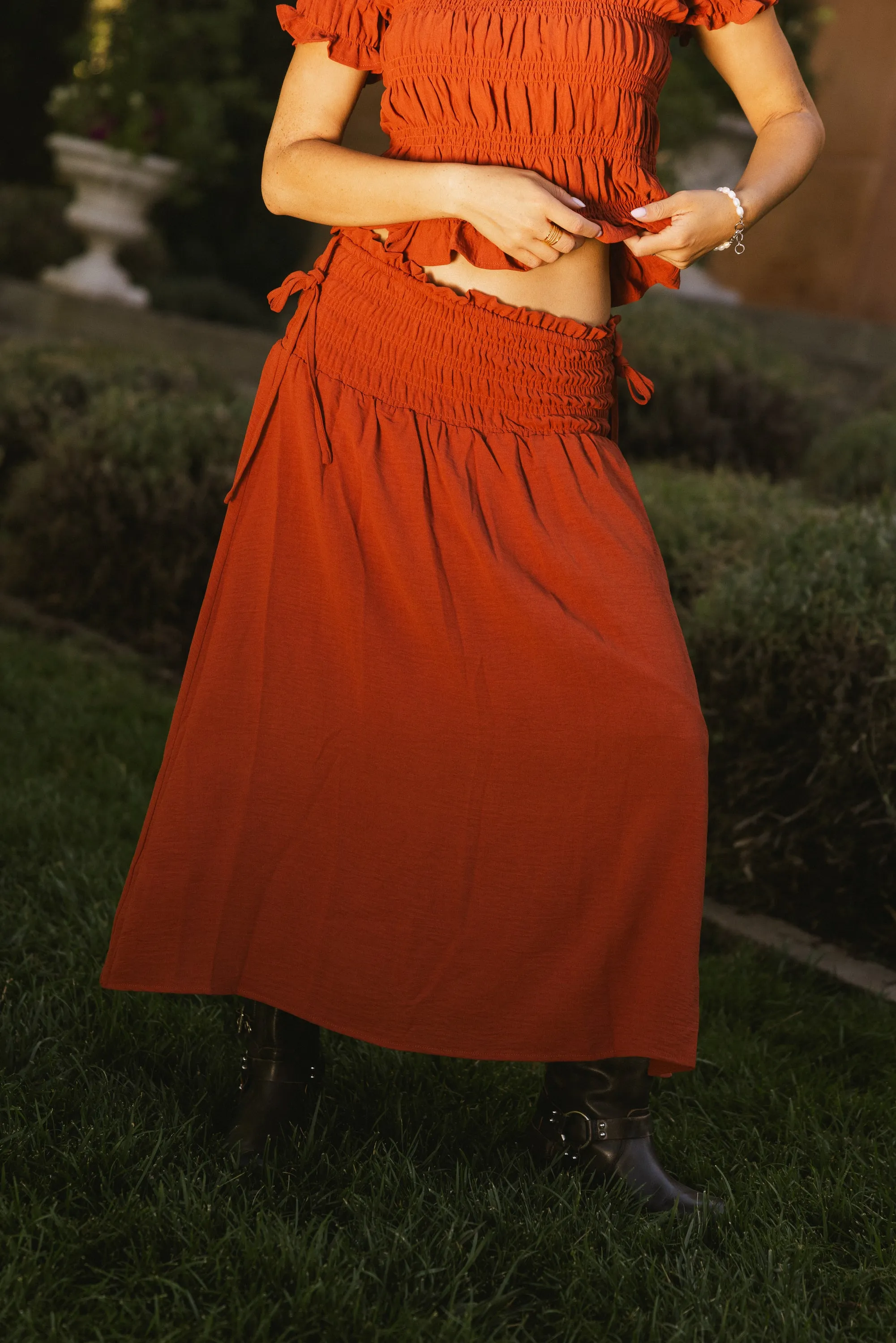 Micah Smocked Maxi Skirt in Rust sold by bohme