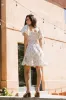 Ari Smocked Mini Dress sold by bohme