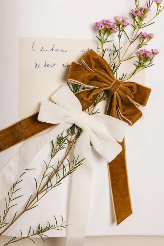 Velvet Bow Hair Clip in Cream sold by bohme